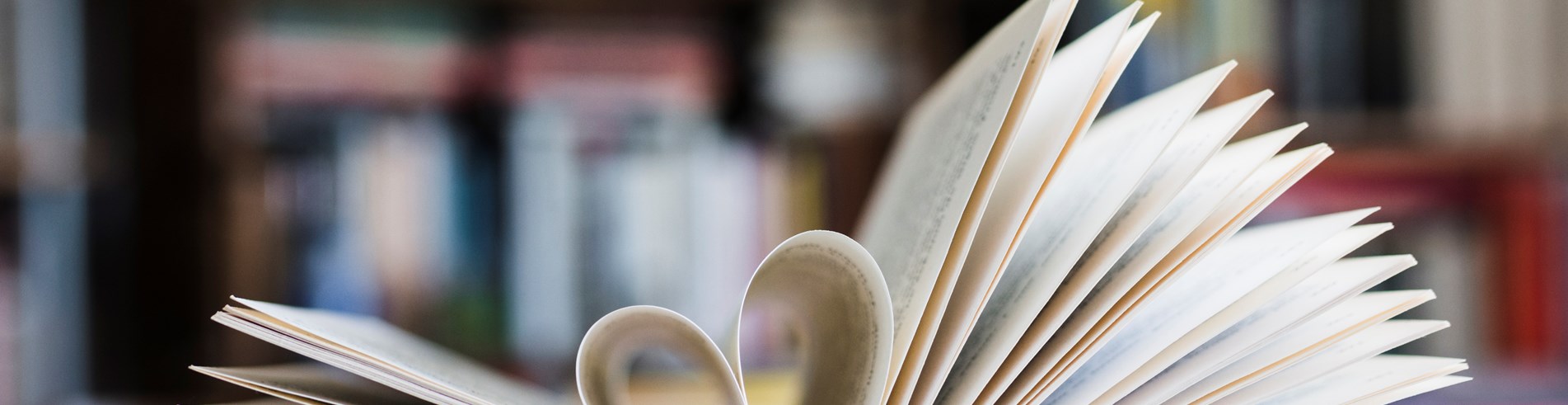 English book open with love heart 