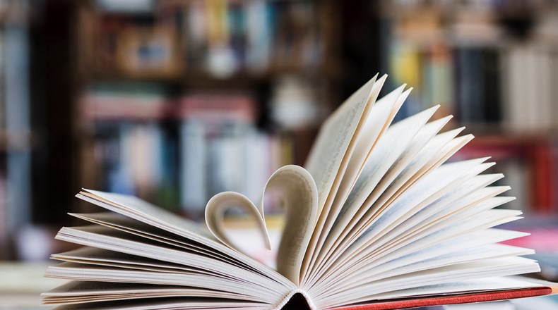 English book open with love heart 